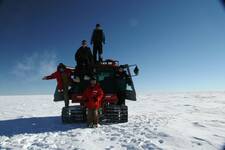 The snow stake crew on the piston bully.JPG